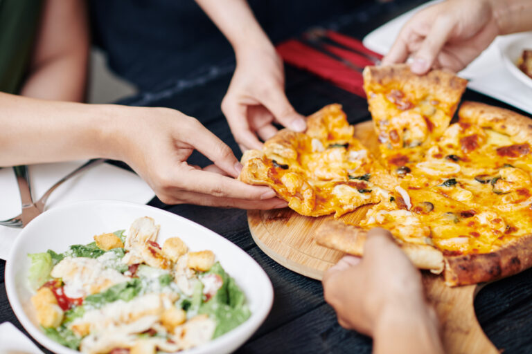 divisive pizza topping crossword